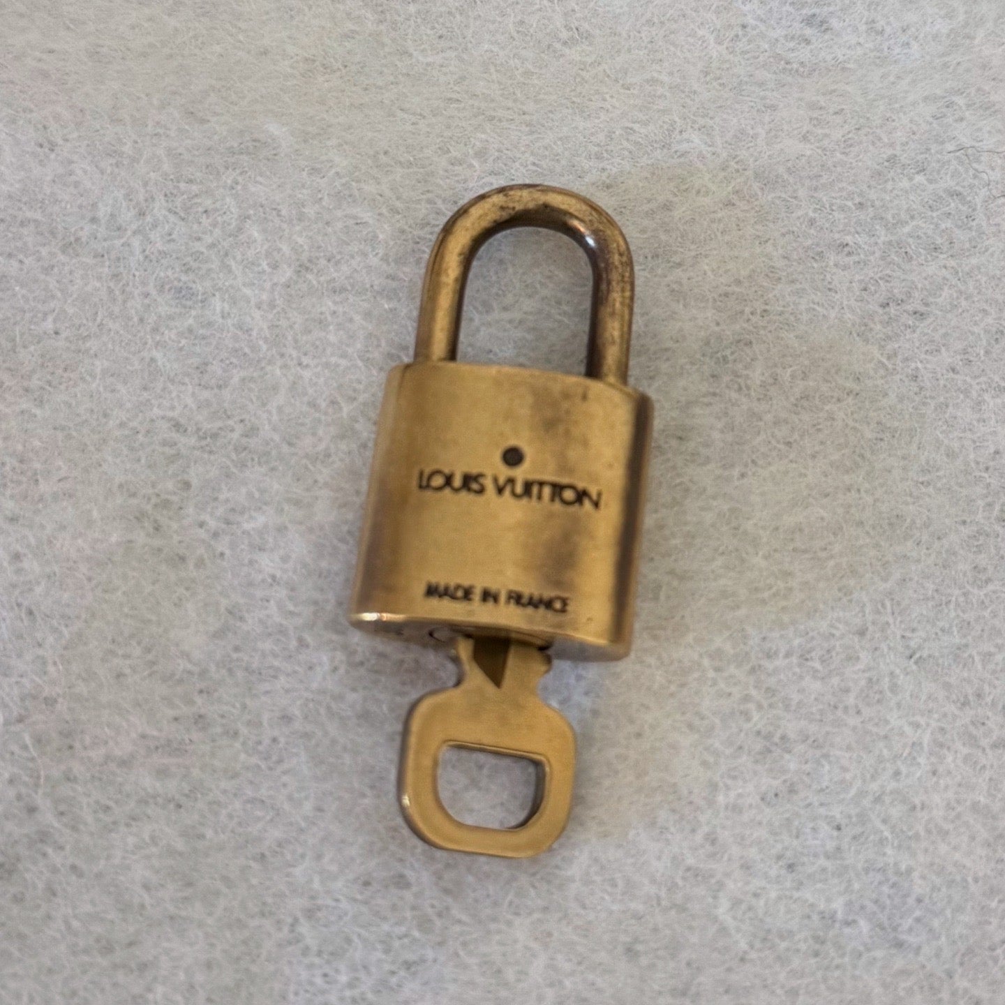 Louis Vuitton Brass Lock - LuxeLadyConnoisseur