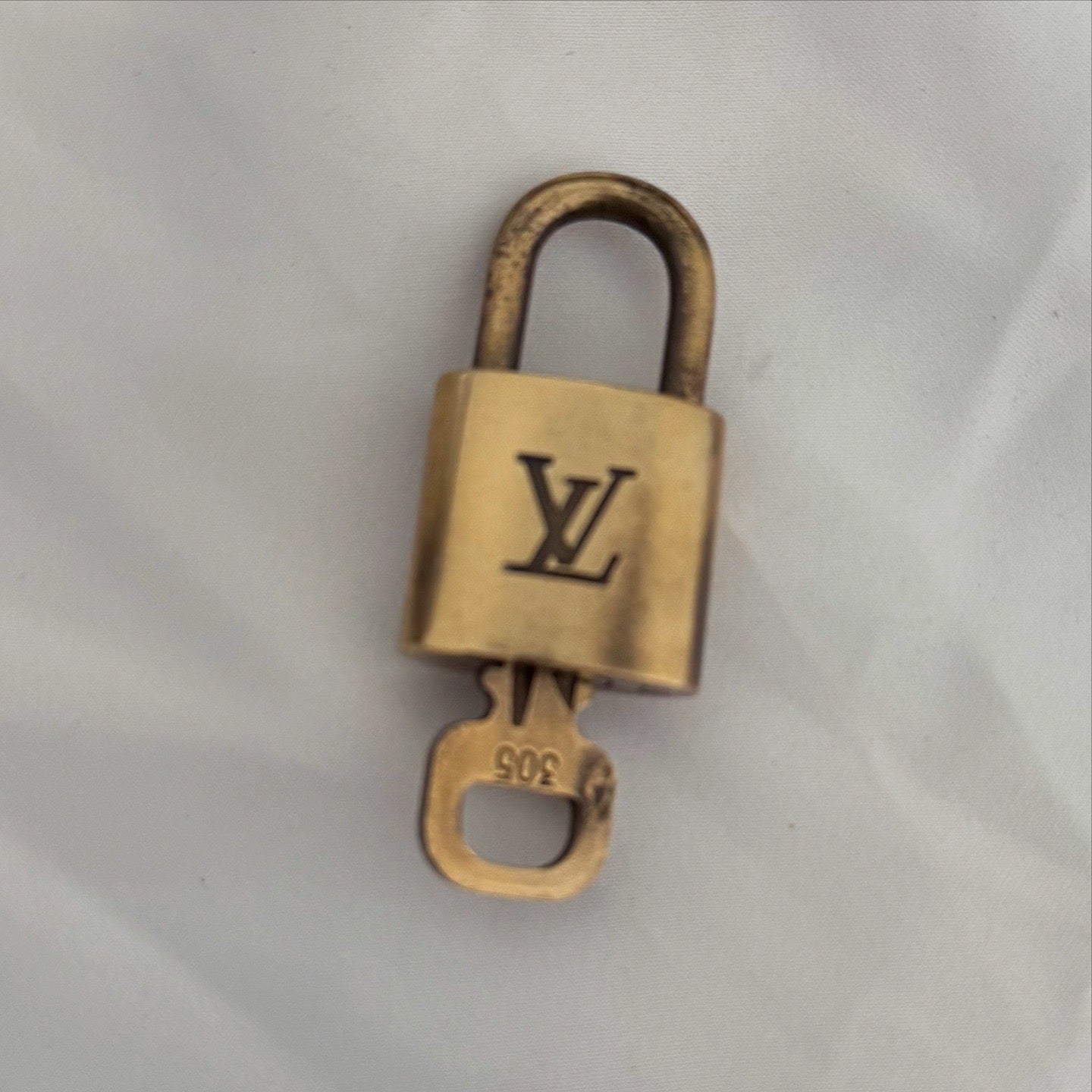 Louis Vuitton Brass Lock - LuxeLadyConnoisseur