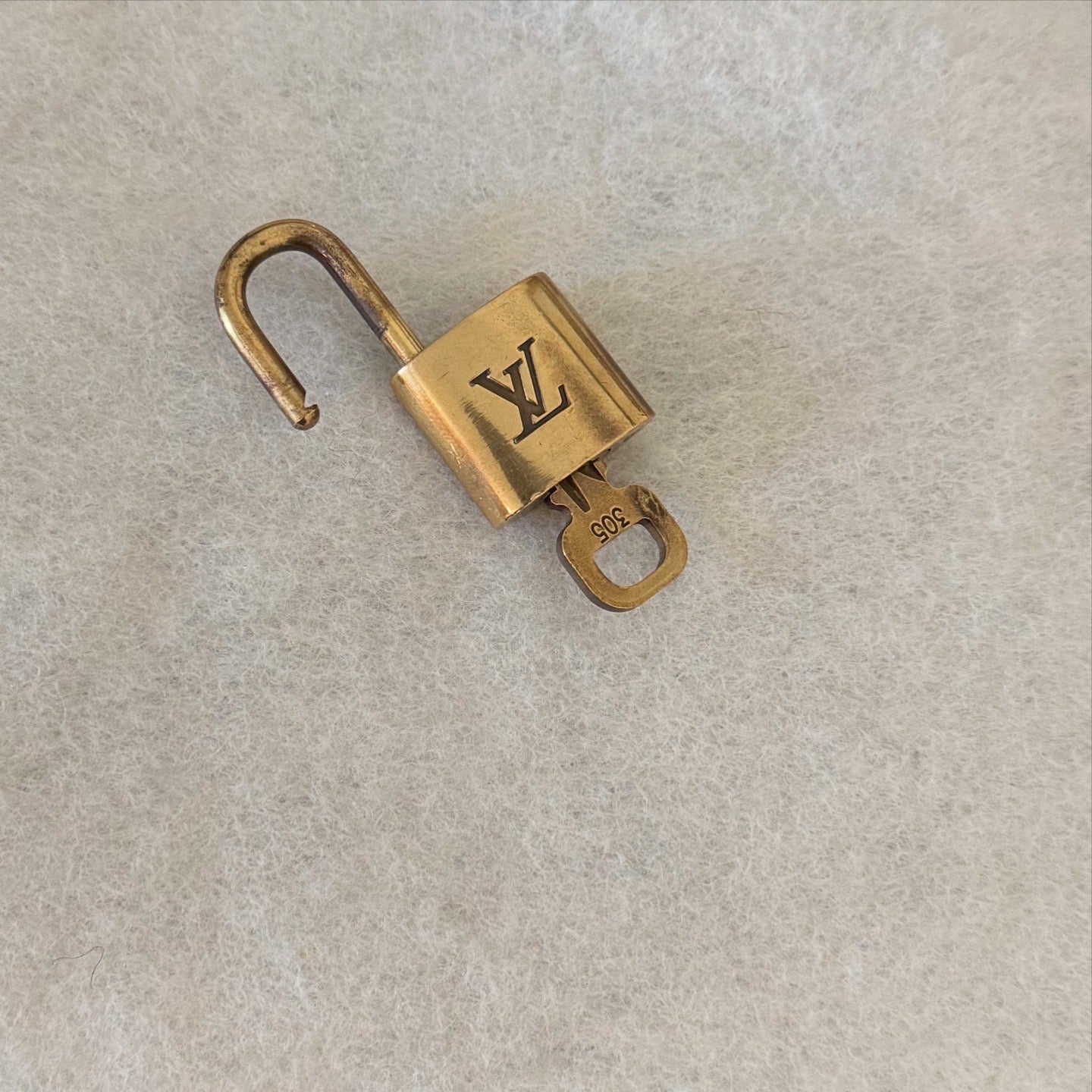 Louis Vuitton Brass Lock - LuxeLadyConnoisseur